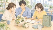 送別会の花と紙袋を前に、同僚たちが予算と準備の分担を相談する様子